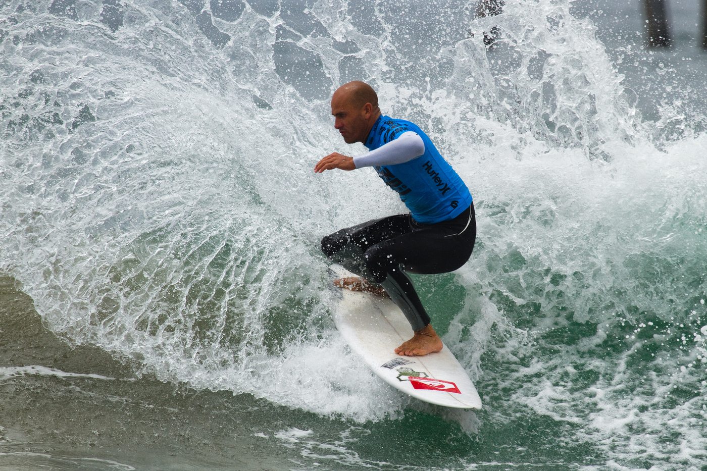 Kelly Slater riding through a breaking wave at the U.S. Open of Surfing, Huntington Beach.